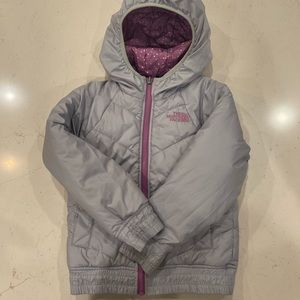 The North Face reversible girls jacket. Grey or purple with dots outside.